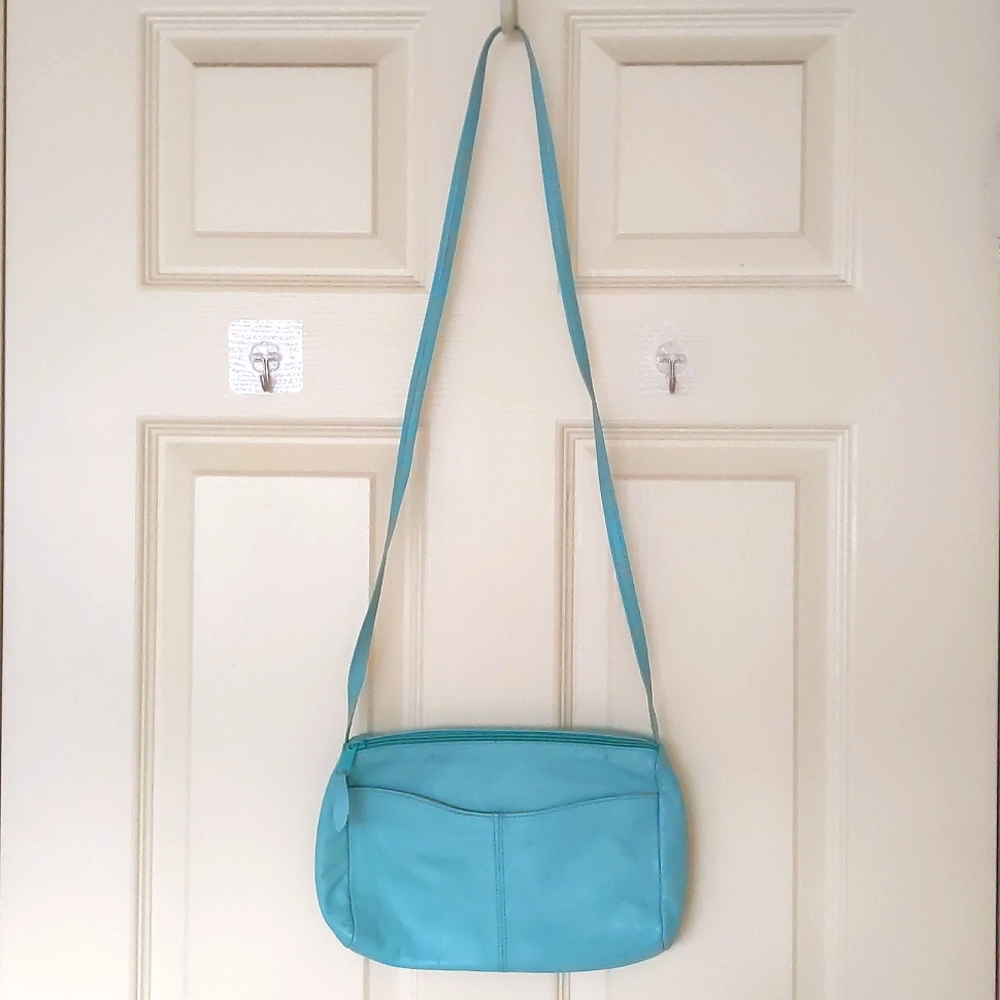 Genuine leather crossbody bag with two layers.